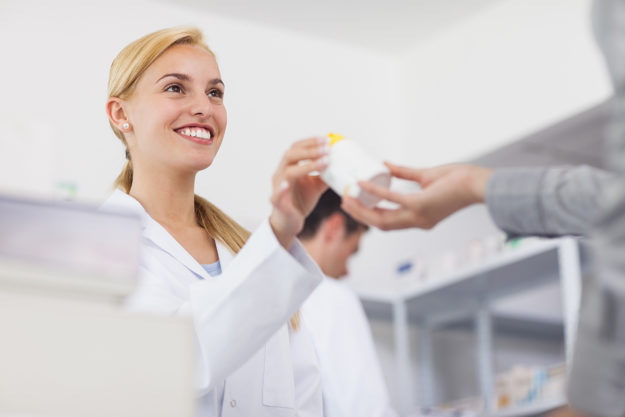 benefits of suboxone treatment woman smiling giving out MAT benefits of suboxone treatment